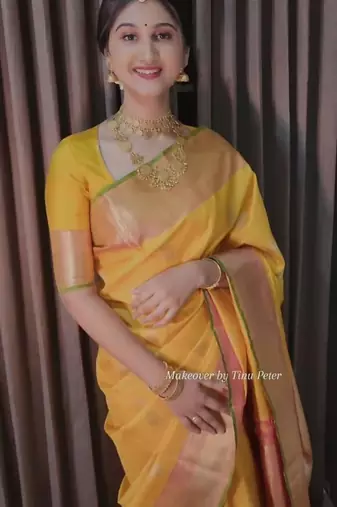 Yellow art silk woven saree with zari work