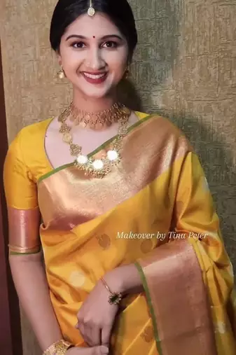 Yellow art silk woven saree with zari work