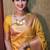 Yellow art silk woven saree with zari work