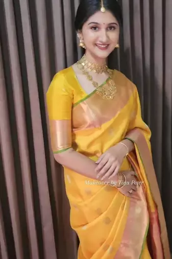 Yellow art silk woven saree with zari work