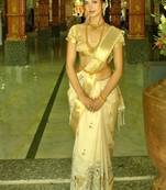 Ivory tusser silkblend saree with designer weaving border & embroidered kalamkari design