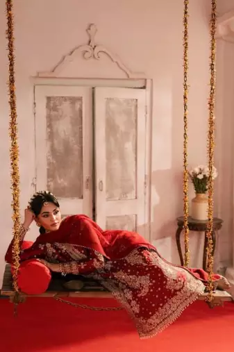 Red roman silk blend embroidered palazzo suit set with faux georgette dupatta