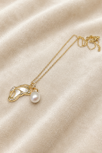 Gold-tone pearl pendant necklace with shell charm and crystal
