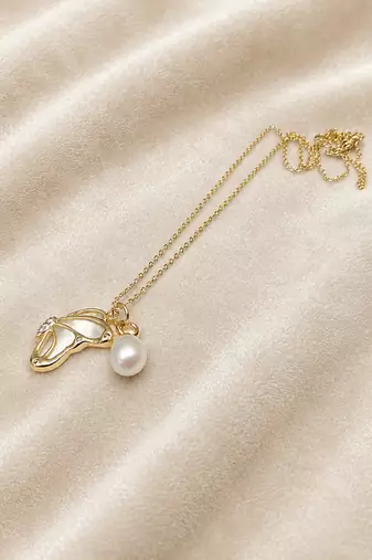 Gold-tone pearl pendant necklace with shell charm and crystal