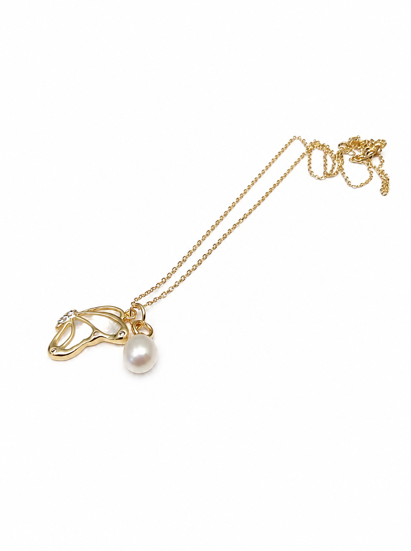 Gold-tone pearl pendant necklace with shell charm and crystal