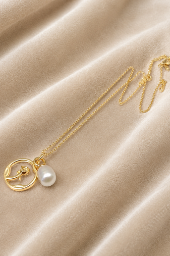 Gold-tone rose charm and freshwater pearl pendant necklace