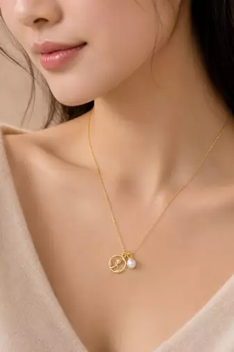 Gold-tone rose charm and freshwater pearl pendant necklace