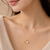 Gold-tone rose charm and freshwater pearl pendant necklace