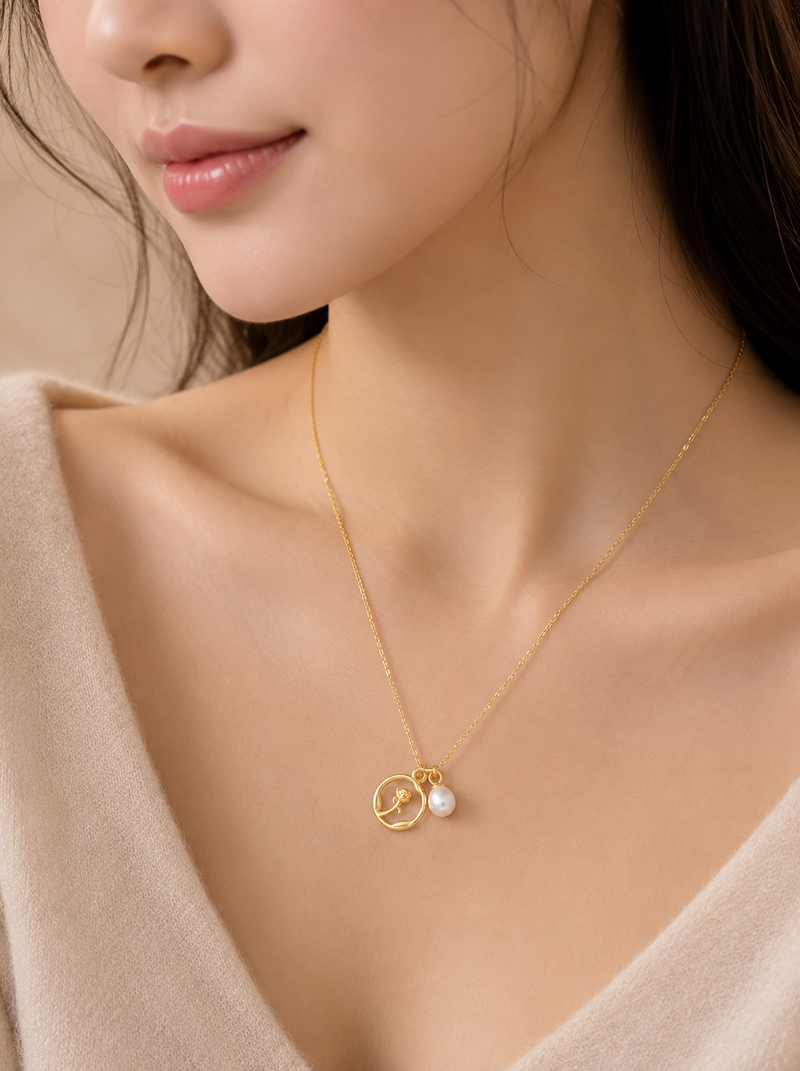 Gold-tone rose charm and freshwater pearl pendant necklace