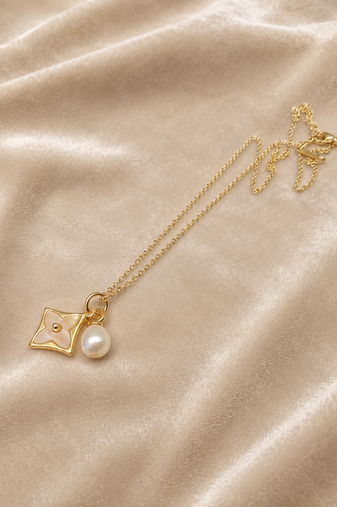 Gold-tone flower charm and pearl pendant necklace