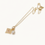 Gold-tone flower charm and pearl pendant necklace
