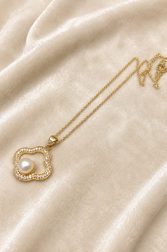Gold-tone clover pearl pendant necklace with crystal accents
