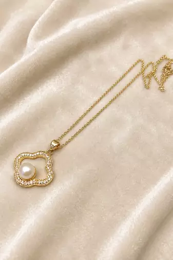 Gold-tone clover pearl pendant necklace with crystal accents