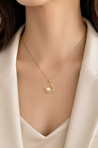 Gold-tone clover pearl pendant necklace with crystal accents