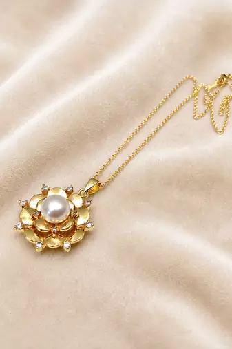 Gold-tone floral pearl pendant necklace with crystal accents