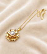 Gold-tone floral pearl pendant necklace with crystal accents