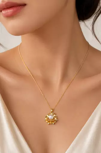 Gold-tone floral pearl pendant necklace with crystal accents