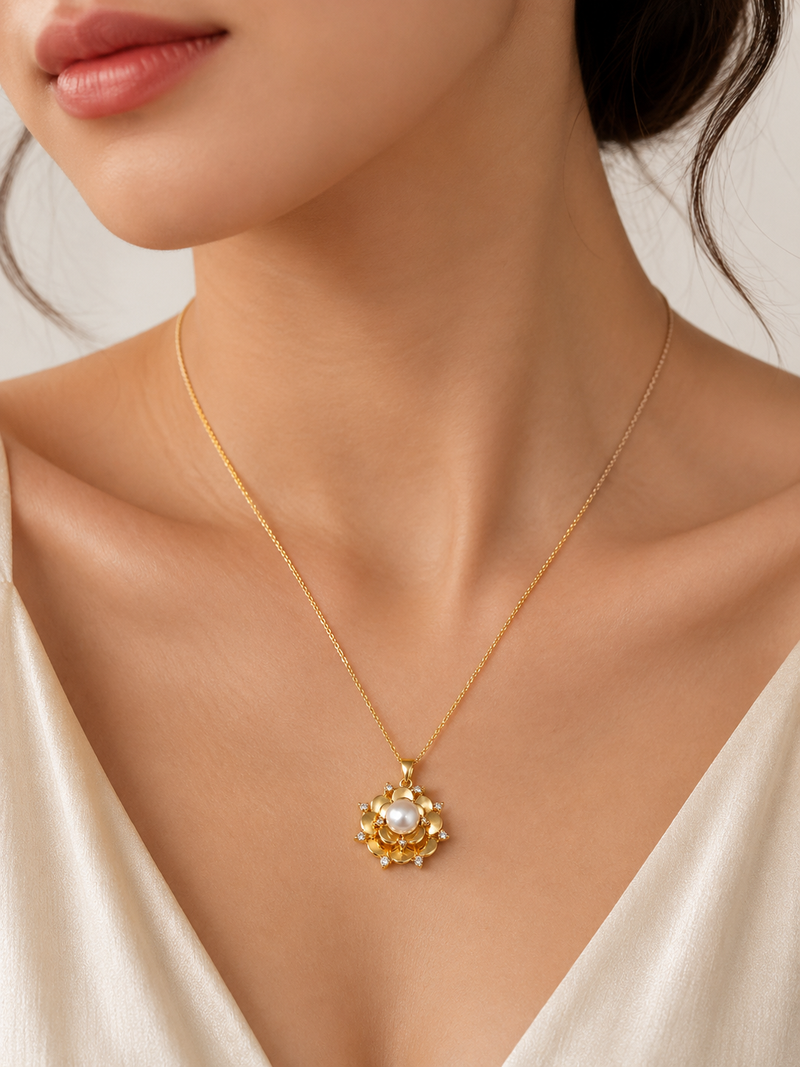 Gold-tone floral pearl pendant necklace with crystal accents