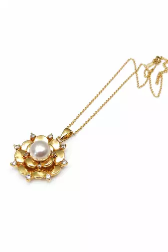 Gold-tone floral pearl pendant necklace with crystal accents