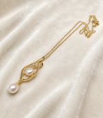 Double pearl pendant necklace with gold-tone chain