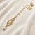 Double pearl pendant necklace with gold-tone chain