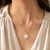 Round mother of pearl pendant necklace with cz halo, gold