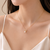 Pearl pendant necklace with crystal crown, gold chain