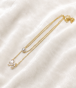 Layered gold chain necklace with pearl and crystal flower