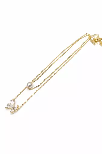Layered gold chain necklace with pearl and crystal flower