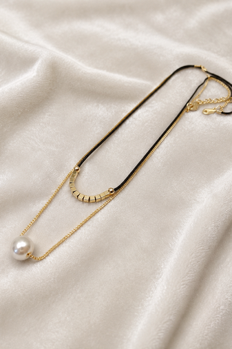 Layered pearl pendant necklace with black cord and gold chain