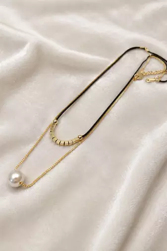Layered pearl pendant necklace with black cord and gold chain