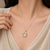 Baroque pearl pendant necklace with gold-tone leaf setting