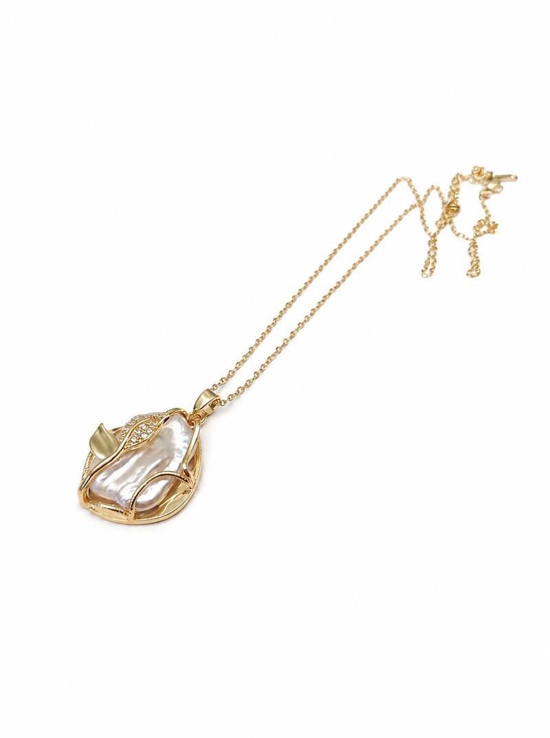 Baroque pearl pendant necklace with gold-tone leaf setting