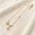 Gold-tone butterfly crystal pearl drop pendant necklace