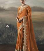 Orange tissue heavy designer border with designer blouse wedding wear saree