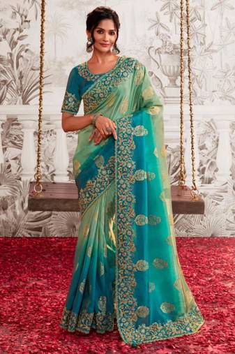 Celebrity type rama shaded multi work  viscose tissue saree with unstitched blouse