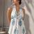 White color printed sleeveless v neck tunic