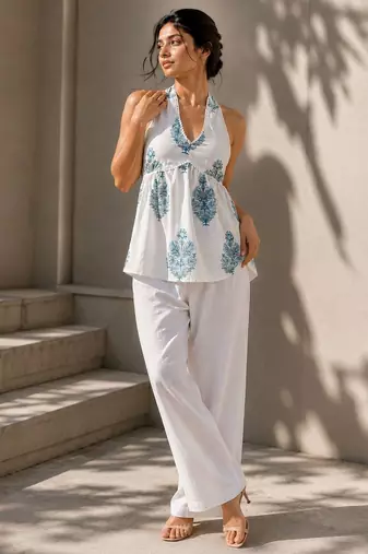 White color printed sleeveless v neck tunic
