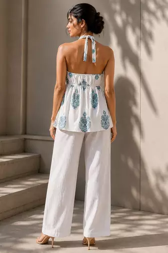 White color printed sleeveless v neck tunic