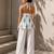 White color printed sleeveless v neck tunic