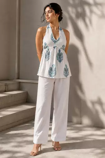White color printed sleeveless v neck tunic