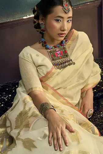 Cream linen silk blend saree with gold zari border & floral pallu