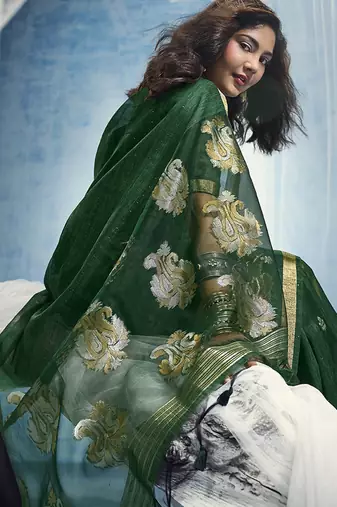 Dark green linen silk blend saree with gold zari border & floral woven pallu