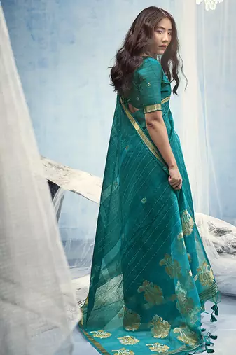 Teal blue linen silk blend saree with gold zari border & floral woven pallu