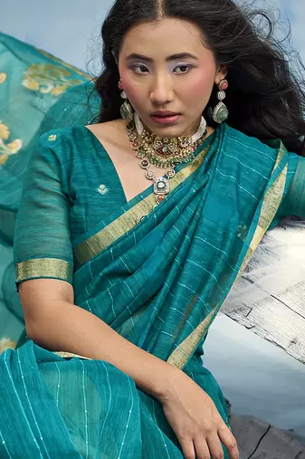 Teal blue linen silk blend saree with gold zari border & floral woven pallu