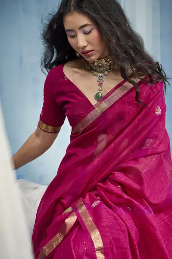 Rani pink linen silk blend saree with gold zari border & floral woven pallu