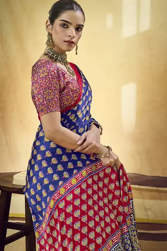 Navy blue satin printed saree with orange border and unstiched blouse