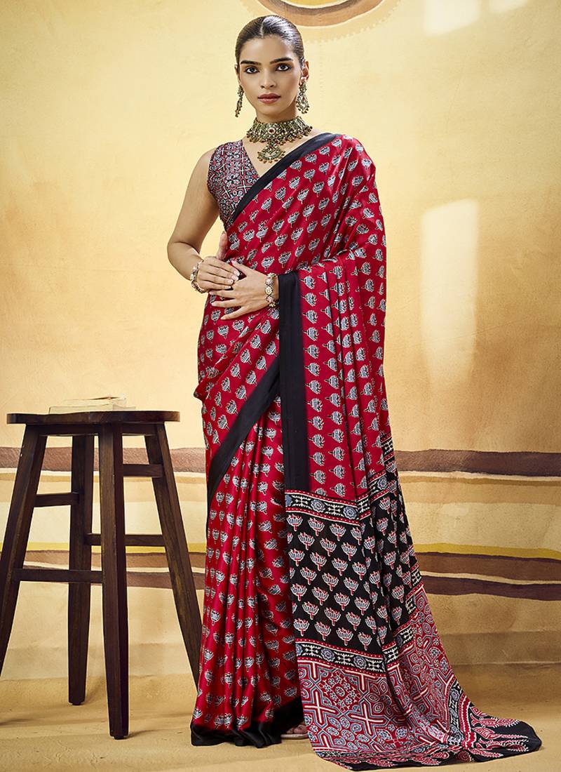 Red satin printed saree with orange border and unstiched blouse