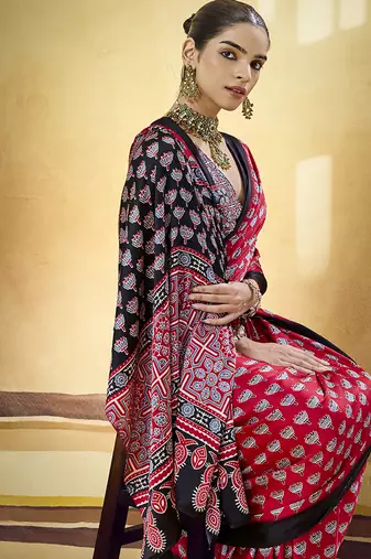Red satin printed saree with orange border and unstiched blouse