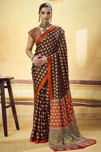 Brown satin printed saree with orange border and unstiched blouse